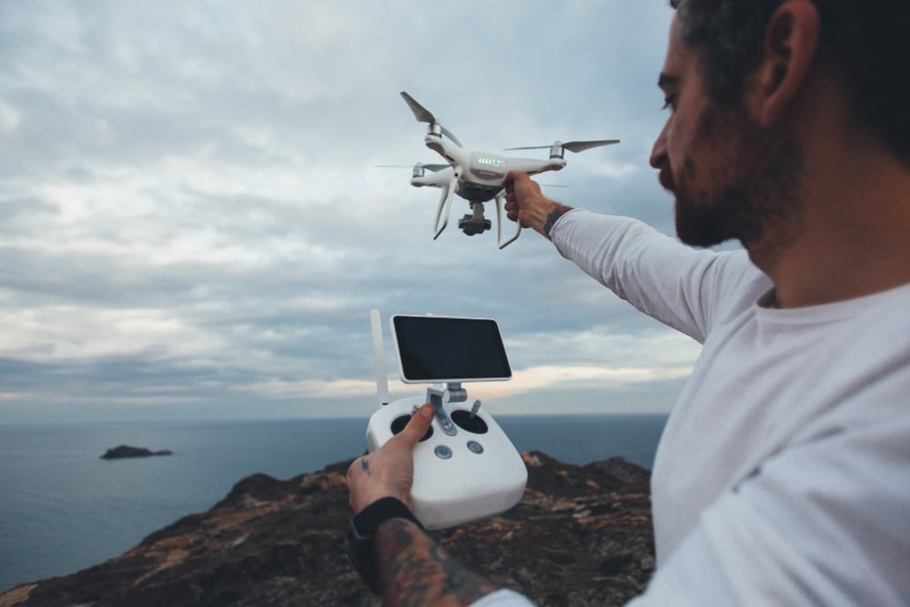 Pilot launching a survey drone